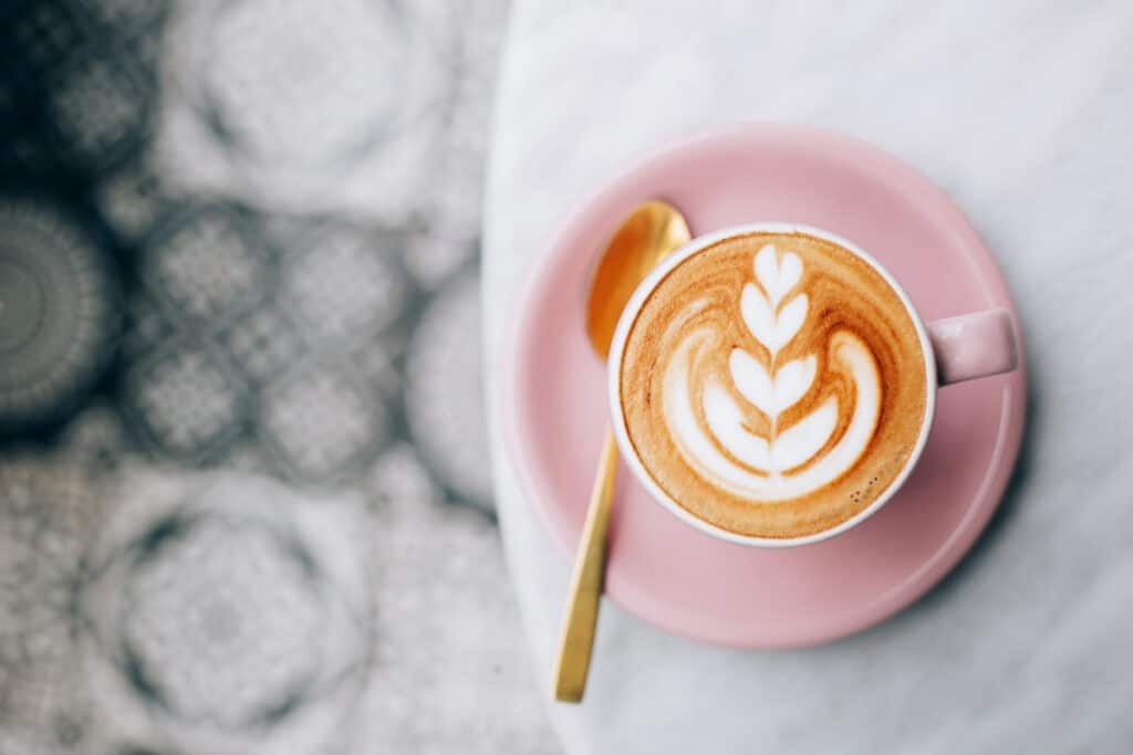 cup of coffee on tablecloth